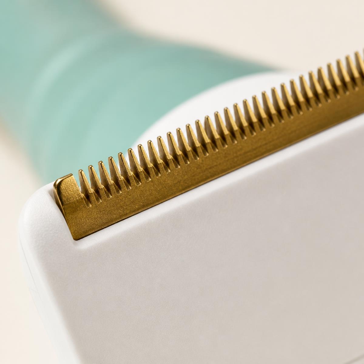 Macro view of the fine copper bristle edge of the Pet Hair Remover Tool